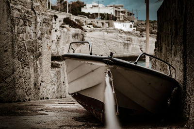 Abandoned boat on land