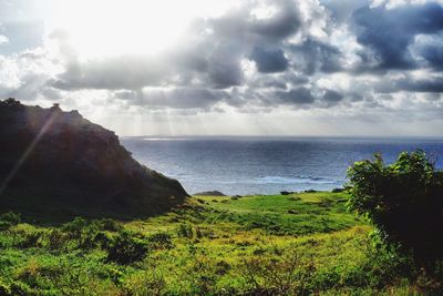 Scenic view of sea against cloudy sky