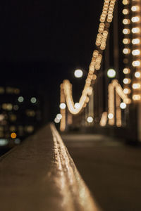 Defocused image of illuminated street lights at night