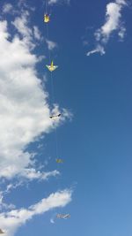 Low angle view of airshow against sky