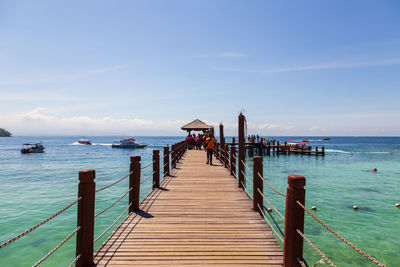 Pier over sea against sky