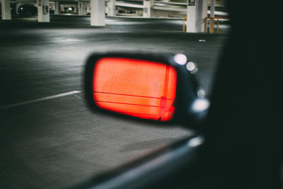 Close-up of reflection in side-view mirror