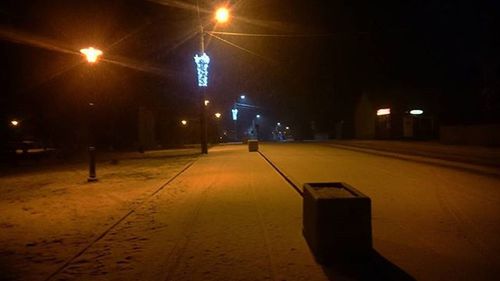 Illuminated street light at night