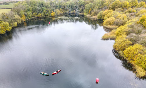 High angle view of lake by trees during autumn