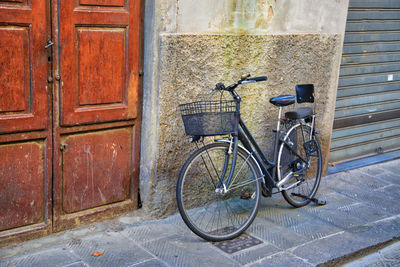 Bicycles on street against building