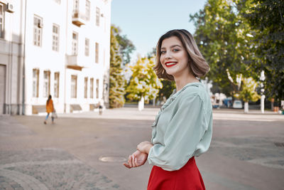 Full length of woman standing in city