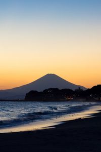 Scenic view of mt fuji against clear sky during sunset