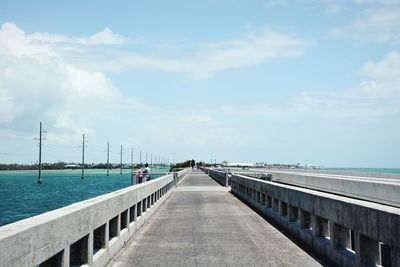 Pier over sea against sky