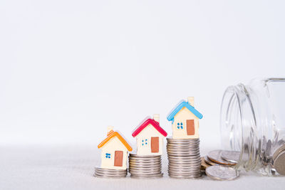 Stack of multi colored pencils against white background