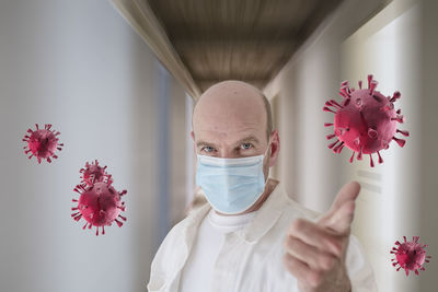 Portrait of person with pink flower in corridor