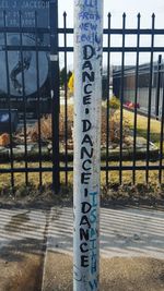 Information sign on chainlink fence