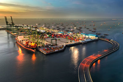 High angle view of city at sunset, new container priok terminal, jakarta  