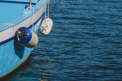 Close-up of boat moored on sea