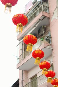 Low angle view of lantern hanging against building