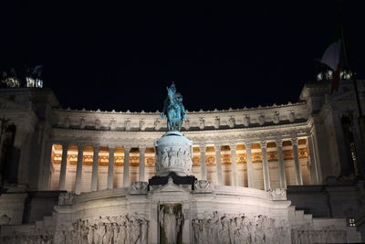 Low angle view of statue at night