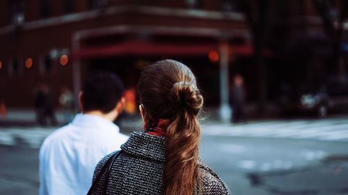 Rear view of woman standing in park