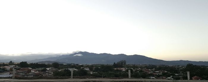 Town with mountain range in background