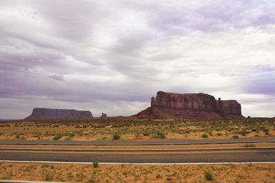 Rock formations on landscape against sky