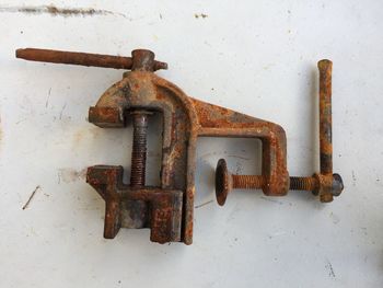 High angle view of rusty metal on wall