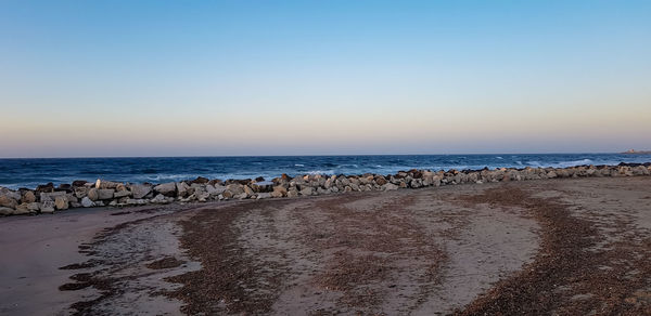 Scenic view of sea against clear sky