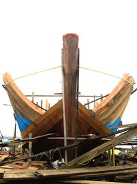 Boat moored against clear sky