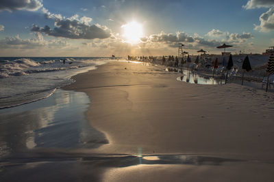 Panoramic view of beach against sky during sunset