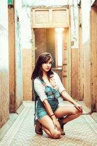 Portrait of a young woman sitting outdoors