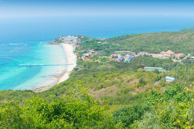 High angle view of trees and sea against sky