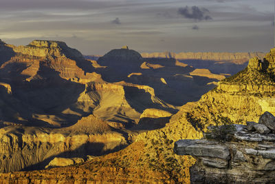 Scenic view of rocks and mountains against sky