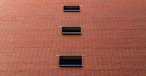 Low angle view of brick wall