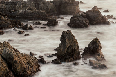 Scenic view of rocks in sea