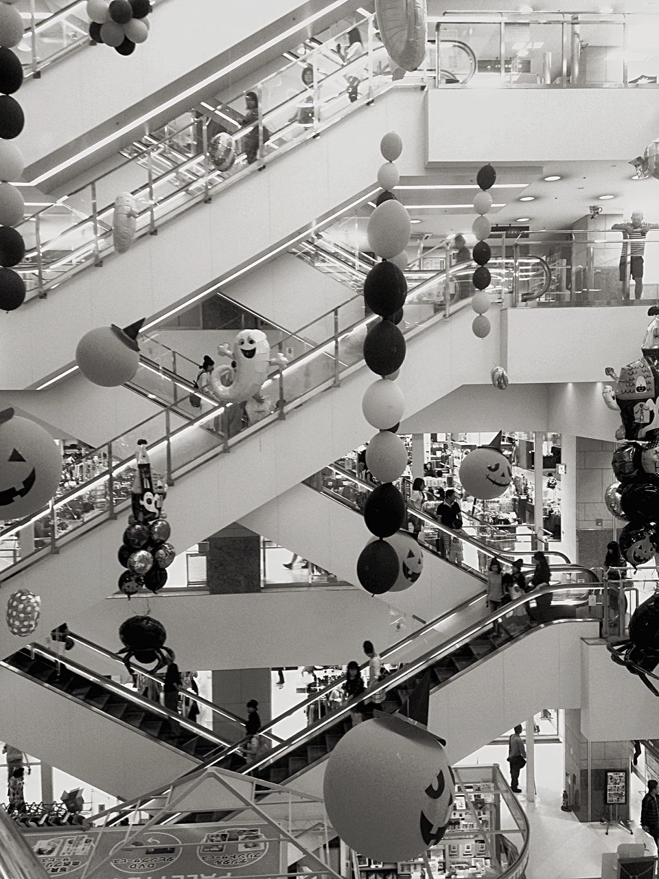 indoors, hanging, variation, ceiling, large group of objects, in a row, choice, store, low angle view, arrangement, architecture, built structure, abundance, order, shopping, retail, business, shopping mall, lighting equipment, modern