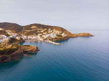 Aerial view of a scenic village on crete at the sea against clear sky