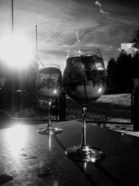 Close-up of beer on table against sky