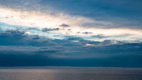 Scenic view of landscape against cloudy sky