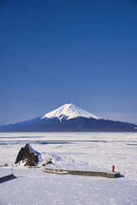 Drift ice in the sea of okhotsk, a winter tradition and mt,fuji composite photo