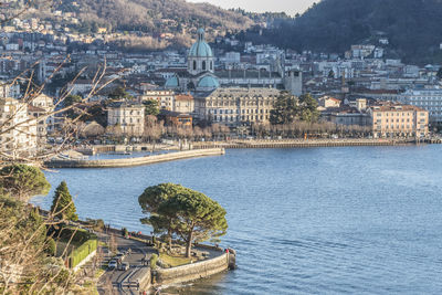 High angle view of river and buildings in city