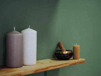 Close-up of candles on table