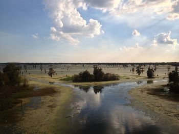 Scenic view of sea against cloudy sky