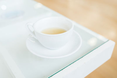 High angle view of coffee cup on table