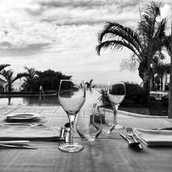 Place setting on table against sky