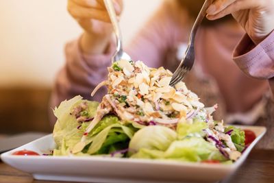 Midsection of person preparing food on table