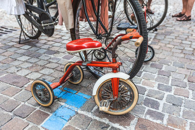 High angle view of bicycle parked on footpath