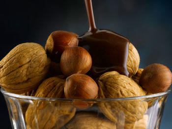 Close-up of fruits in container on table