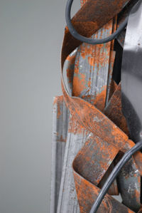 Close-up of rusty metal against wall