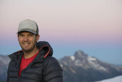 Portrait of active man smiling in the mountains.