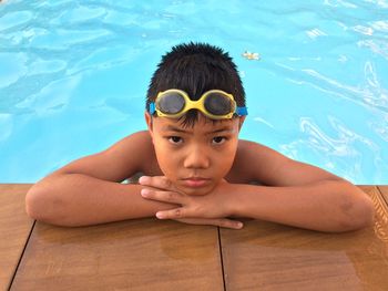 Portrait of shirtless boy in swimming pool