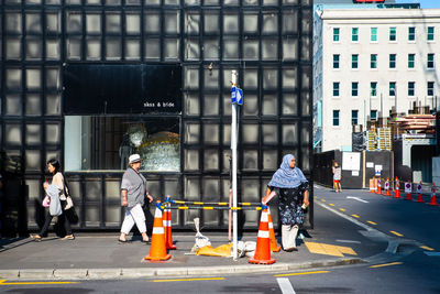 People standing on street in city