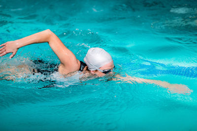 Man swimming in pool