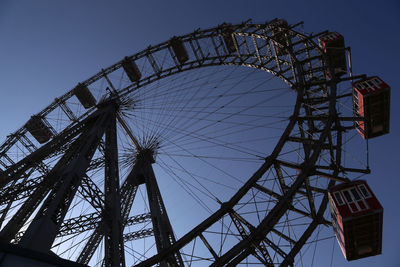 Low angle view of ferris wheel against sky